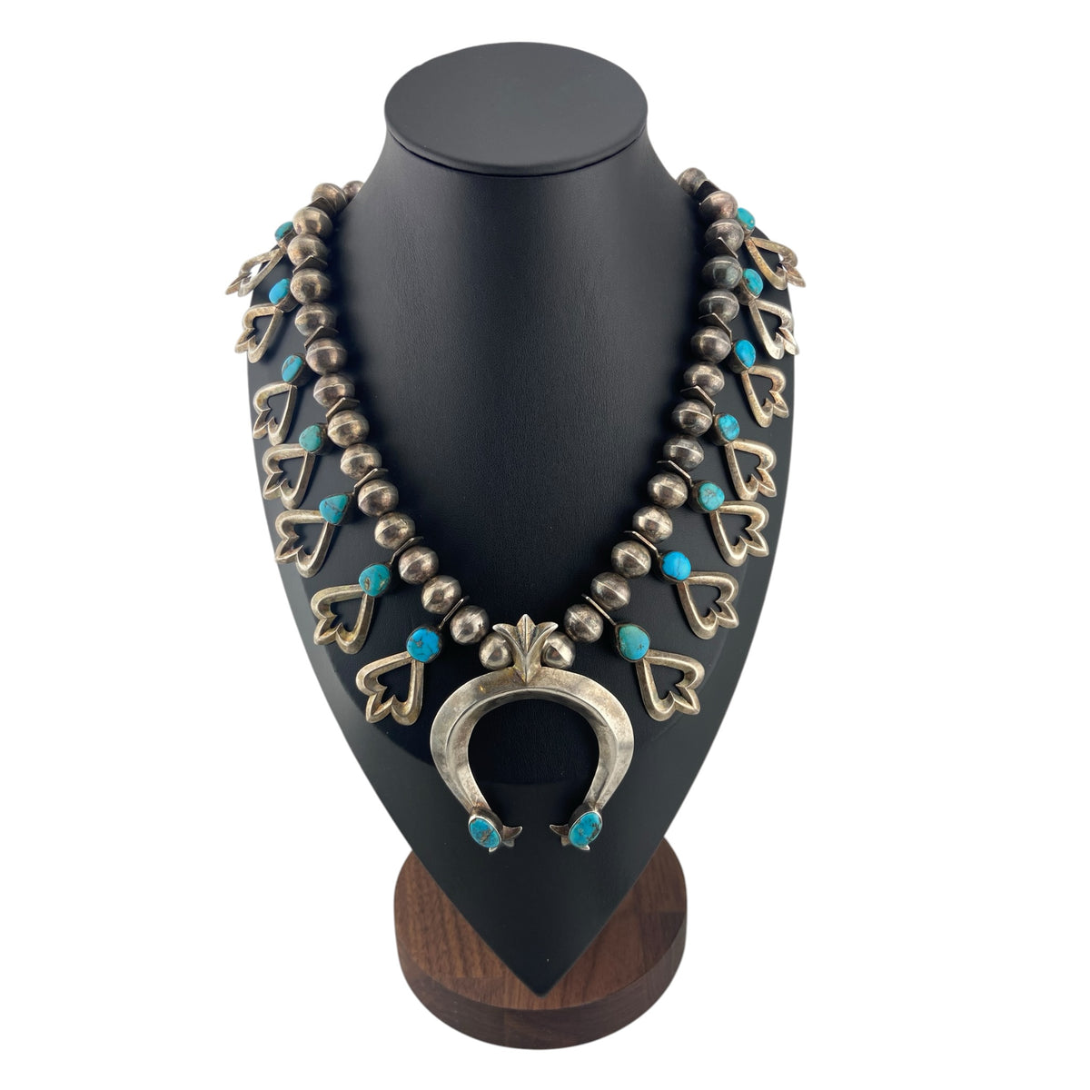 sterling silver, turquoise, navajo pearls, tufa cast, squash blossom