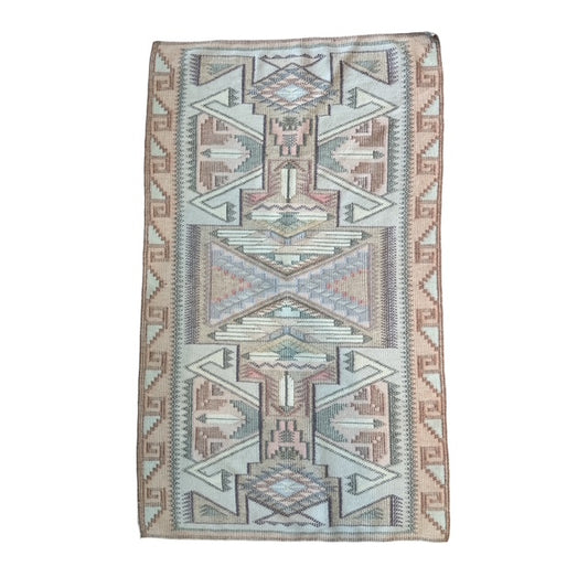 Woven rug with geometric pattern on a white background.  Navajo rug for sale, raised outline navajo weaving 
