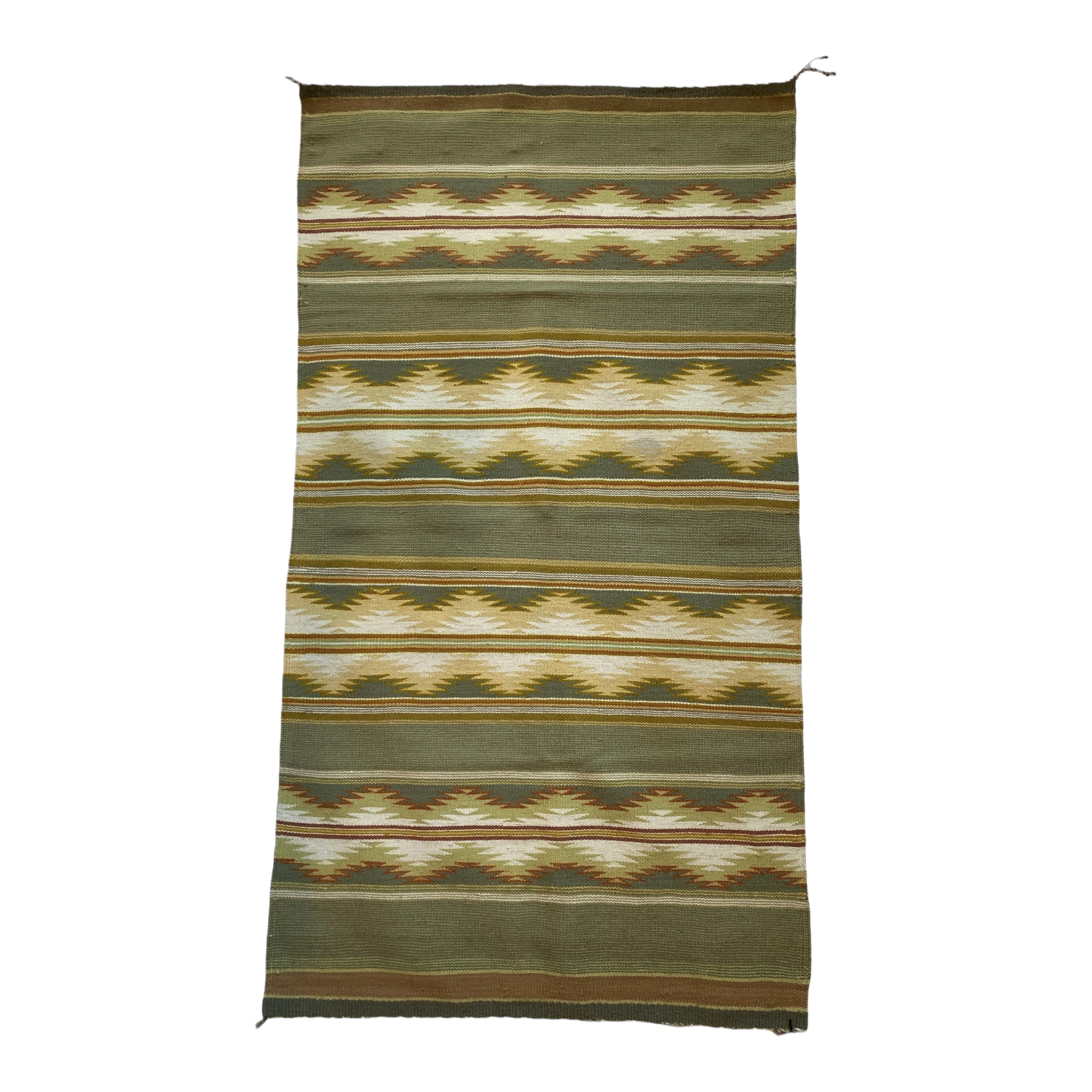 A vintage Pine Springs Weaving rug with a geometric pattern primarily in beige, brown, and green colors.